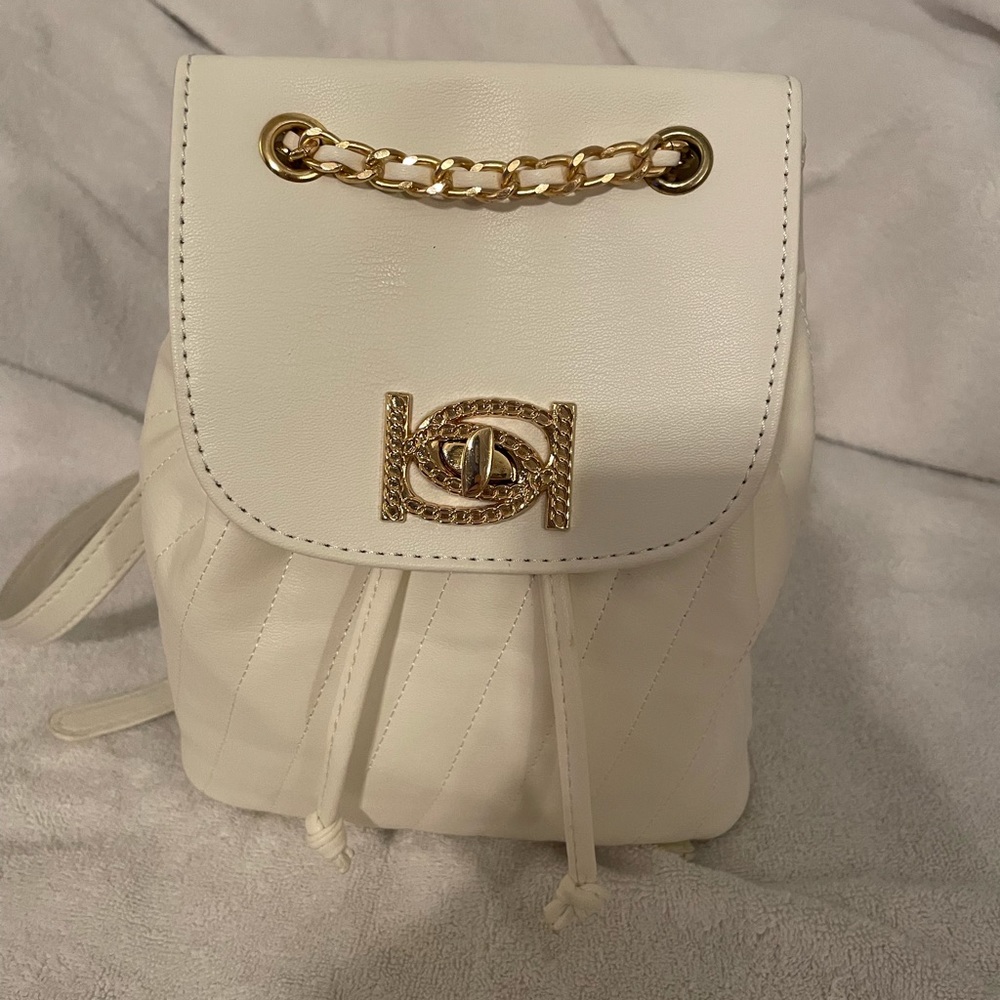 New without tags Bebe shoulder pack. Leather, been in storage